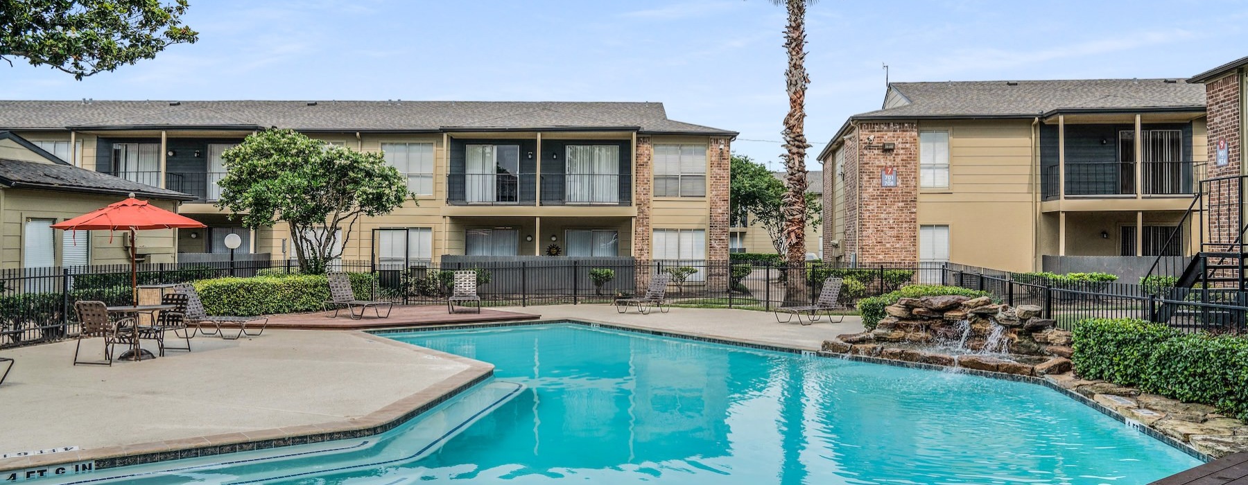a swimming pool in front of a house