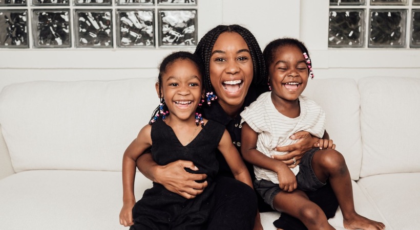 a woman and her kids smiling
