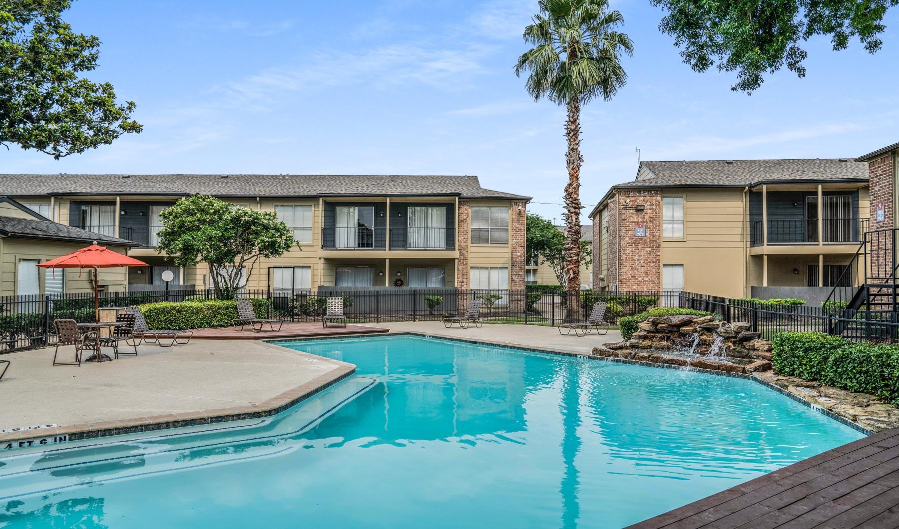 a swimming pool in front of a house