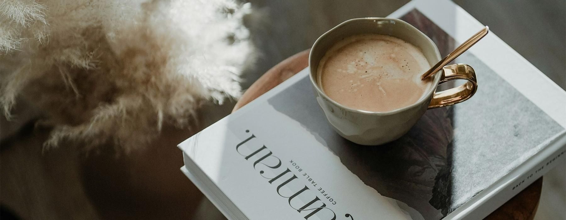a cup of coffee on a book